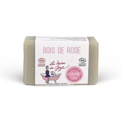 Savon artisanal parfumé au BOIS DE ROSE de la marque 'Les Savons de Joya', affichant des certifications 'COSMOS ORGANIC' et 'BIO'. Le savon est de couleur uniforme, pèse 100g, et est noté comme étant 100% d'origine naturelle.