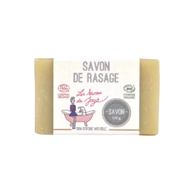 Savon de rasage de couleur crème, étiqueté SAVON DE RASAGE de Les Savons de Joya. Certifié COSMOS ORGANIC et BIO, ce savon de 100g est décrit comme 100% d'origine naturelle, conçu pour une utilisation douce et hydratante.