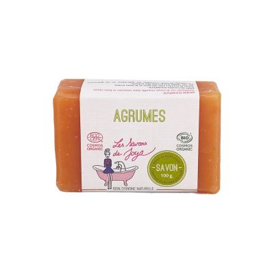 Savon aux agrumes de couleur orange, étiquetée AGRUMES, de la marque Les Savons de Joya. Le produit, pesant 100 grammes, est certifié COSMOS ORGANIQUE et BIO, avec l'indication 100% d'origine naturelle sur l'emballage.