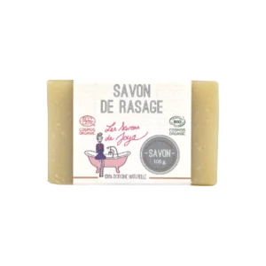 Savon de rasage de couleur crème, étiqueté SAVON DE RASAGE de Les Savons de Joya. Certifié COSMOS ORGANIC et BIO, ce savon de 100g est décrit comme 100% d'origine naturelle, conçu pour une utilisation douce et hydratante.